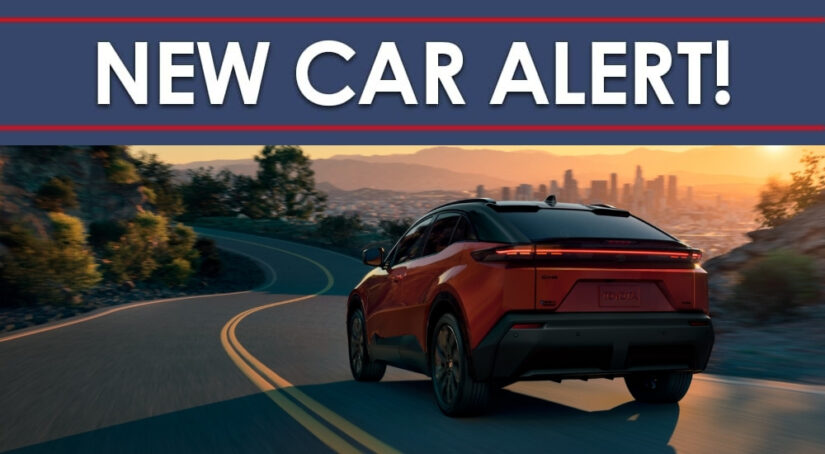 An orange 2026 Toyota C-HR from the rear.