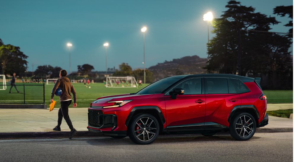 A 2026 Toyota RAV4 hybrid parked near a soccer field.