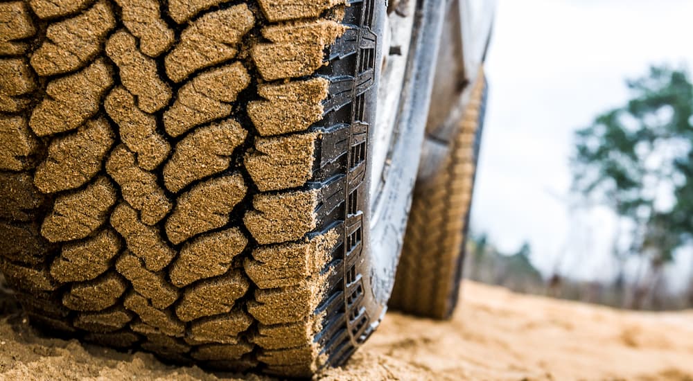 All-Terrain tires off-road on sandy surface