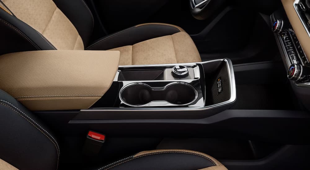 Black and tan front seat and center console of a 2026 Chevy Equinox for sale.