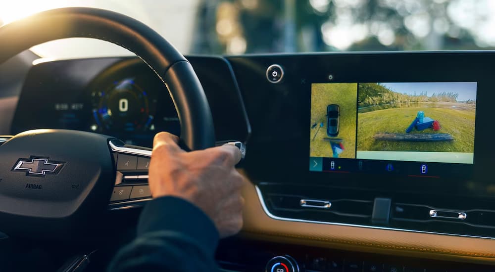 Man using backup camera in a 2026 Chevy Equinox ACTIV.