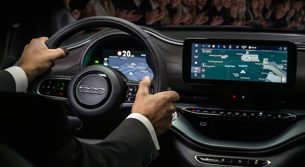 Infotainment and digital gauge cluster in a 2025 Fiat 500e Giorgio Armani edition