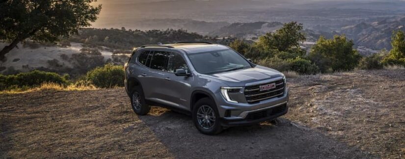 A gray 2025 GMC Acadia parked off-road