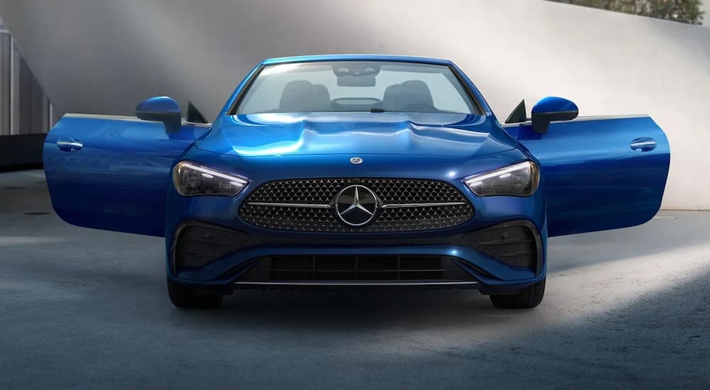 A blue 2025 Mercedes-Benz CLE parked with its doors open