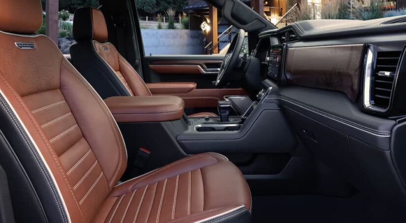 The black and brown interior and dash in a 2025 GMC Sierra 1500 for sale.