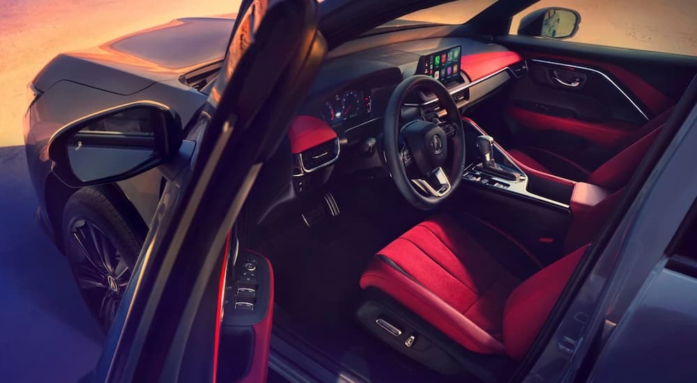 Red and black interior inside a 2025 Acura ADX