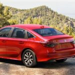 A red 2026 Honda Civic LX parked near a cliff.
