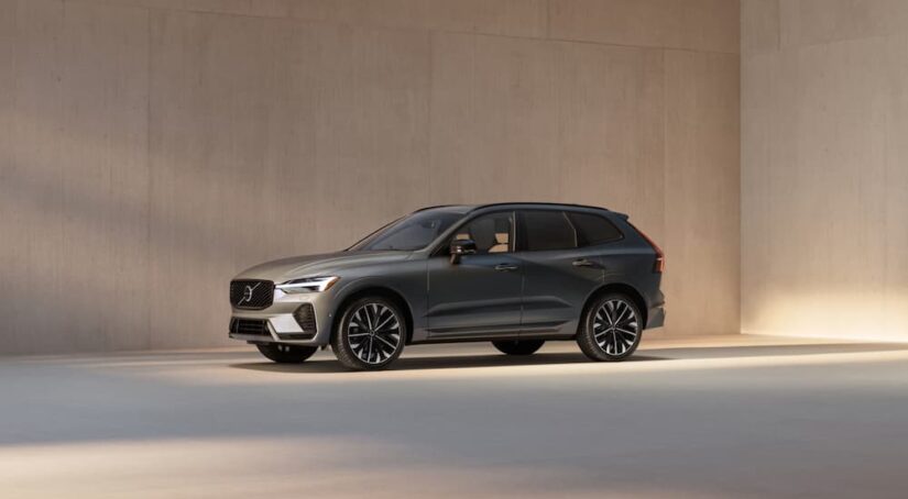 A gray 2026 Volvo XC60 parked in a concrete showroom