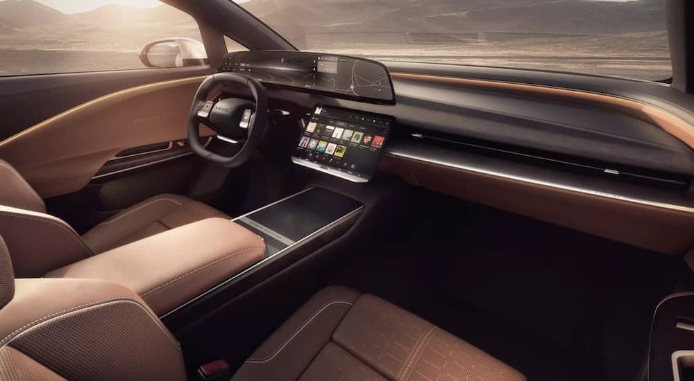 The black and brown interior and dash in a 2025 Lucid Air Gravity.