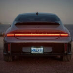 Silver 2025 Hyundai IONIQ 6 parked on a shore