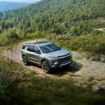 Grey 2026 Chevy Traverse Z71 driving on a trail