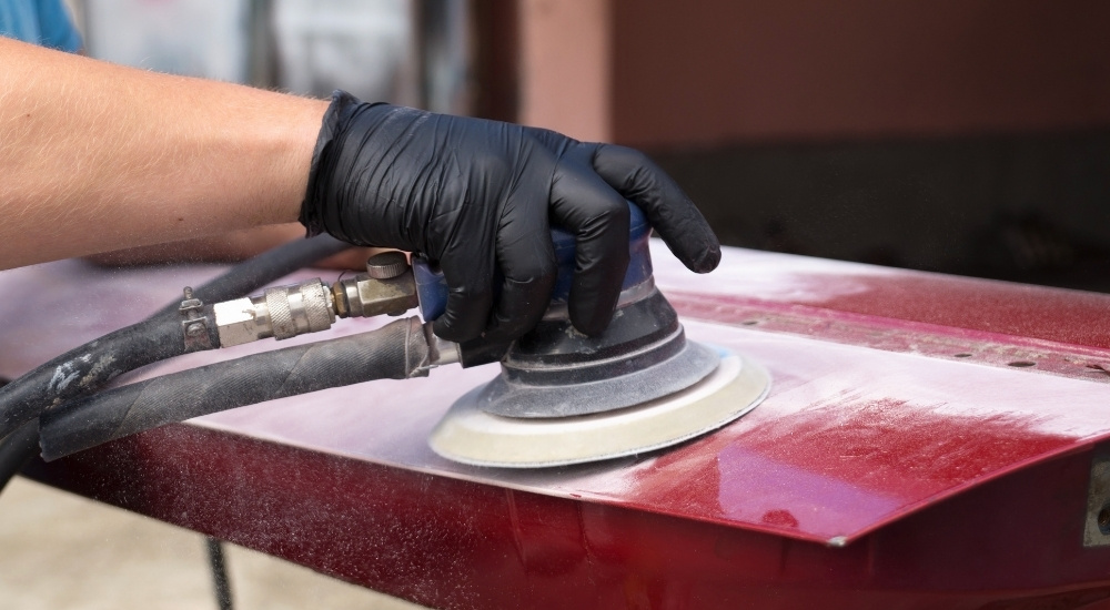 Trunk lid being sanded