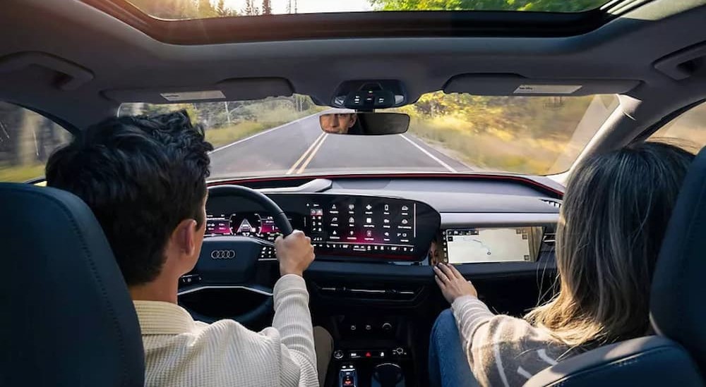 People driving in a 2025 Audi Q5.