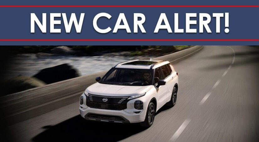White 2026 Nissan Rogue PHEV under a new car alert banner