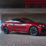 A red 2026 BMW 4 Series Coupe parked outdoors.