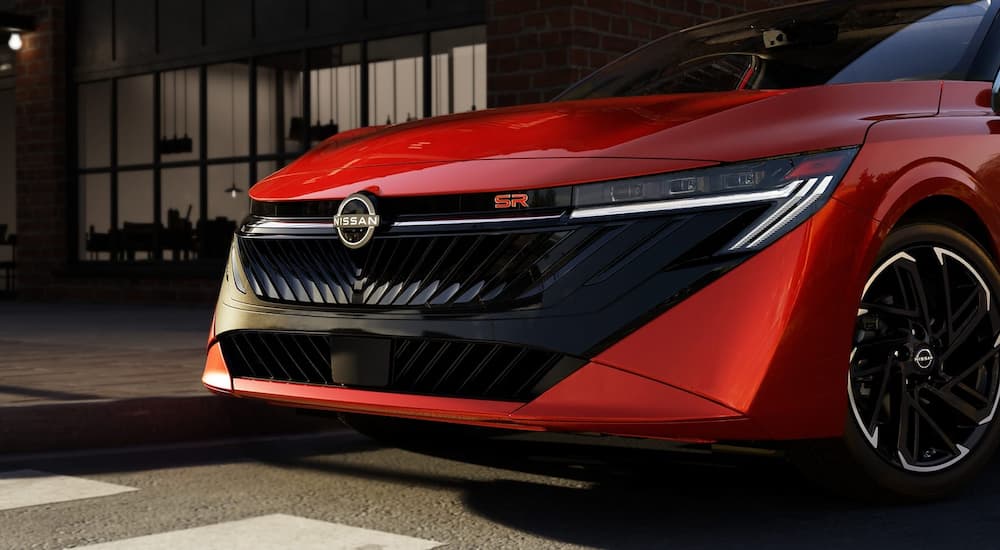 Front grille and headlights on a red 2026 Nissan Sentra SR