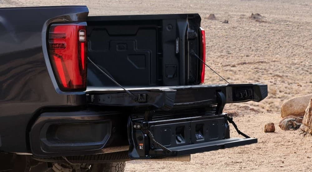 Open tailgate on a black 2026 GMC Sierra 2500.