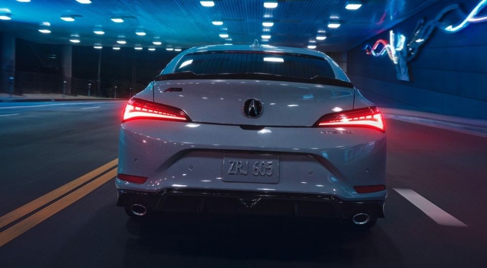 Grey 2026 Acura Integra driving through an tunnel
