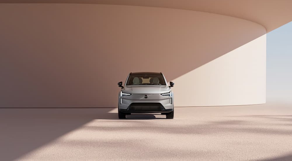 A silver 2026 Volvo EX90 parked during the day.