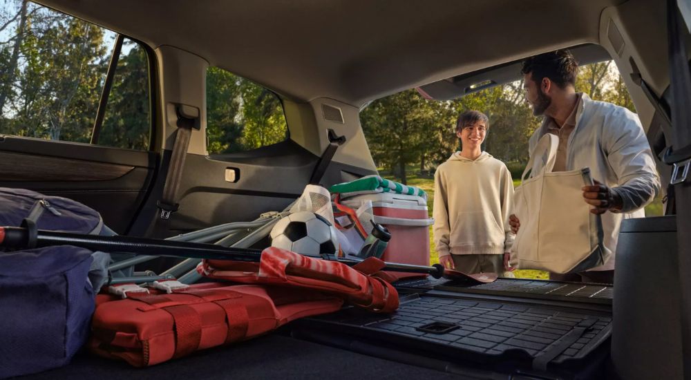 Family loading cargo into a 2026 Volkswagen Atlas