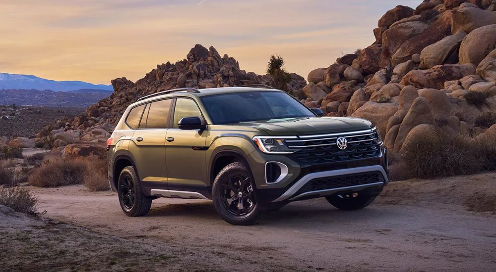 Green 2026 Volkswagen Atlas driving through the desert