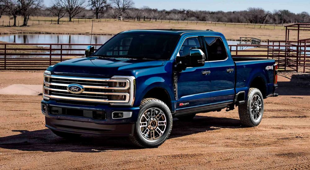 Blue 2025 Ford F-250 4-Door parked on a ranch