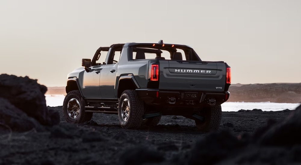 White 2026 GMC Hummer EV Pickup parked at dusk
