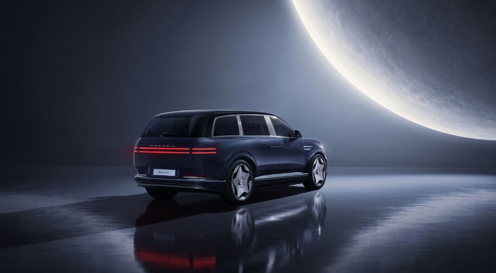 Blue 2027 Genesis GV90 Neolun First Edition overlooking a moon